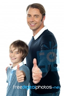 confident-father-and-son-duo-gesturing-thumbs-up-100177610.jpg